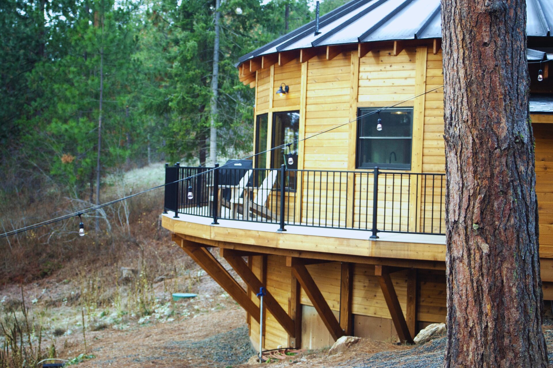Custom elevated deck construction at Happy Hill Yurt by Blue Sky Decks.
