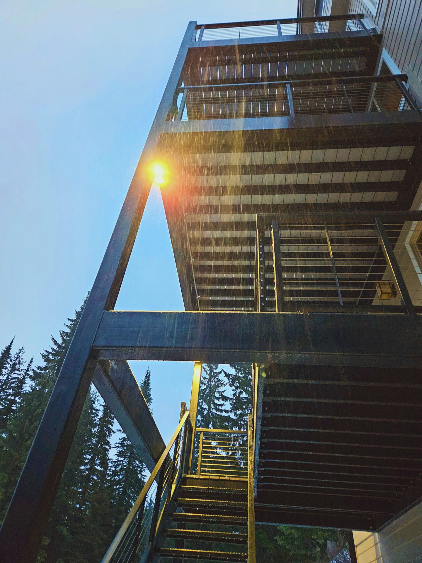 Multi-level steel-framed deck and staircase at Schweitzer Ski House built by Blue Sky Decks.
