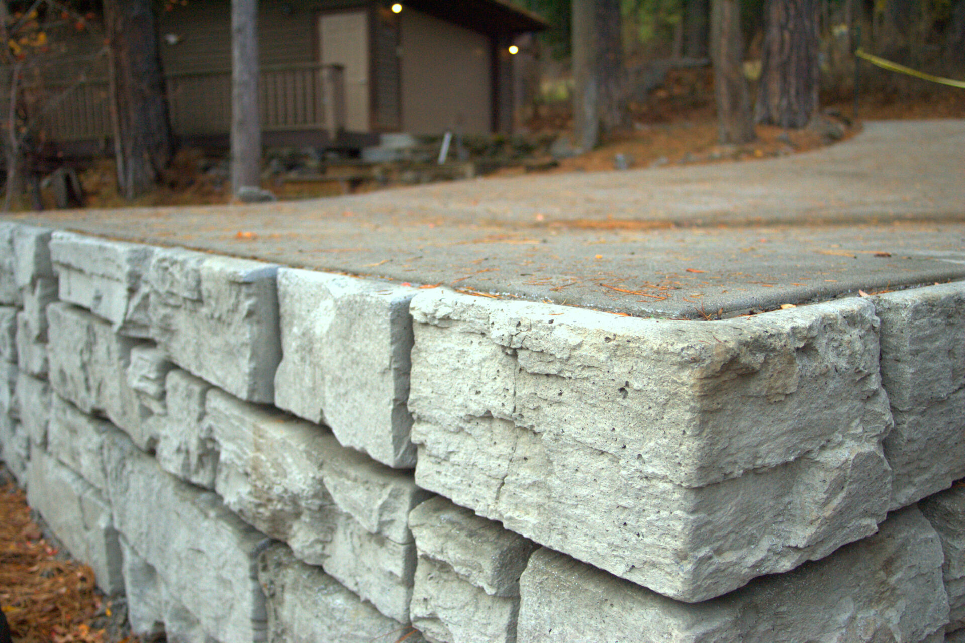 Stanton hardscape project featuring stone retaining wall and stair installation by Blue Sky Decks.