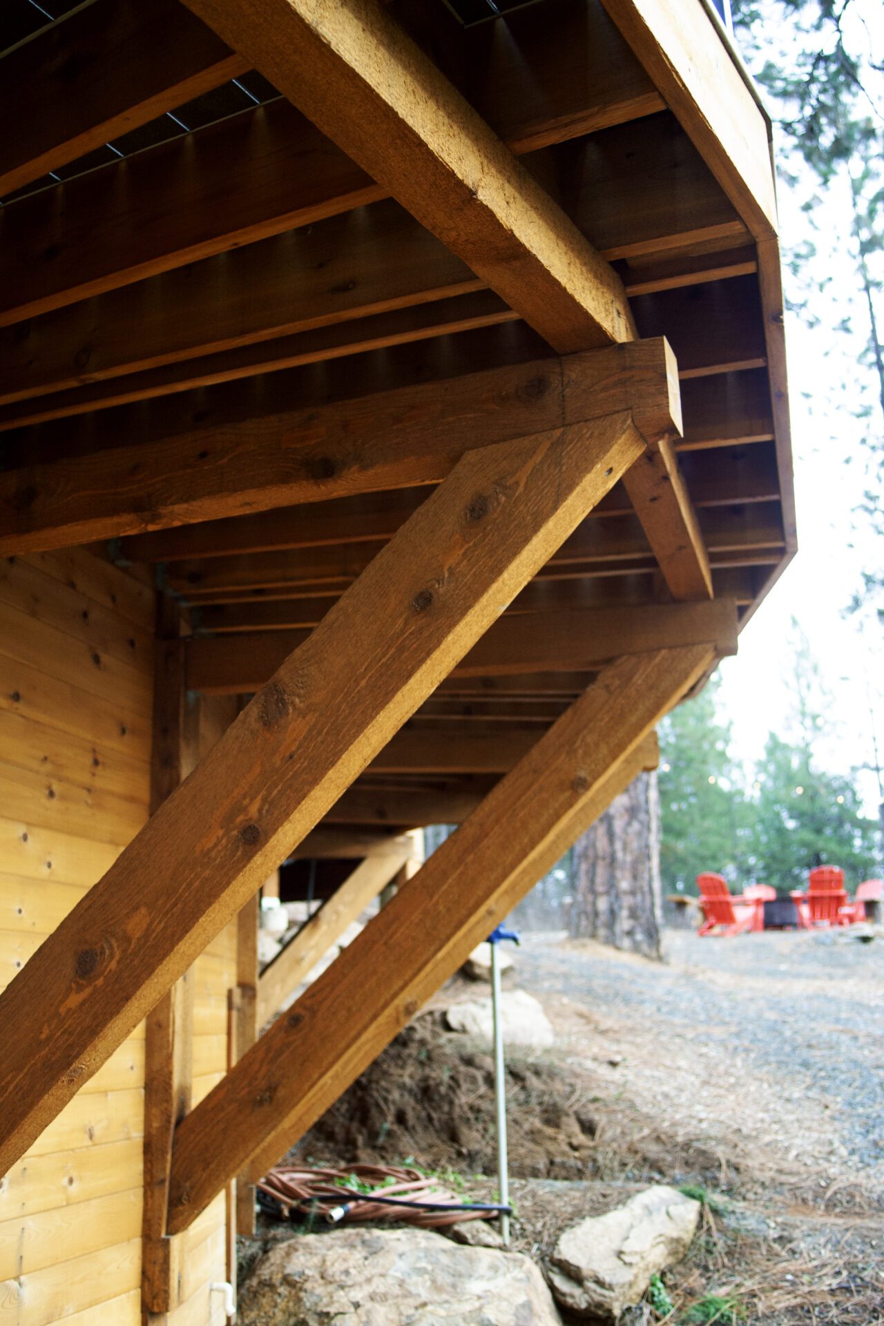 Structural wood framing supporting elevated deck at Happy Hill Yurt built by Blue Sky Decks.