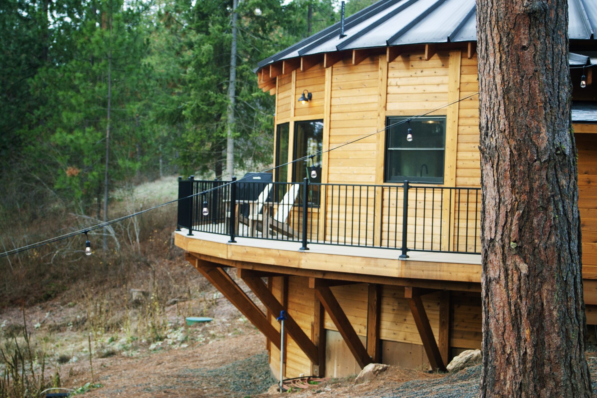 Custom elevated deck construction at Happy Hill Yurt by Blue Sky Decks.