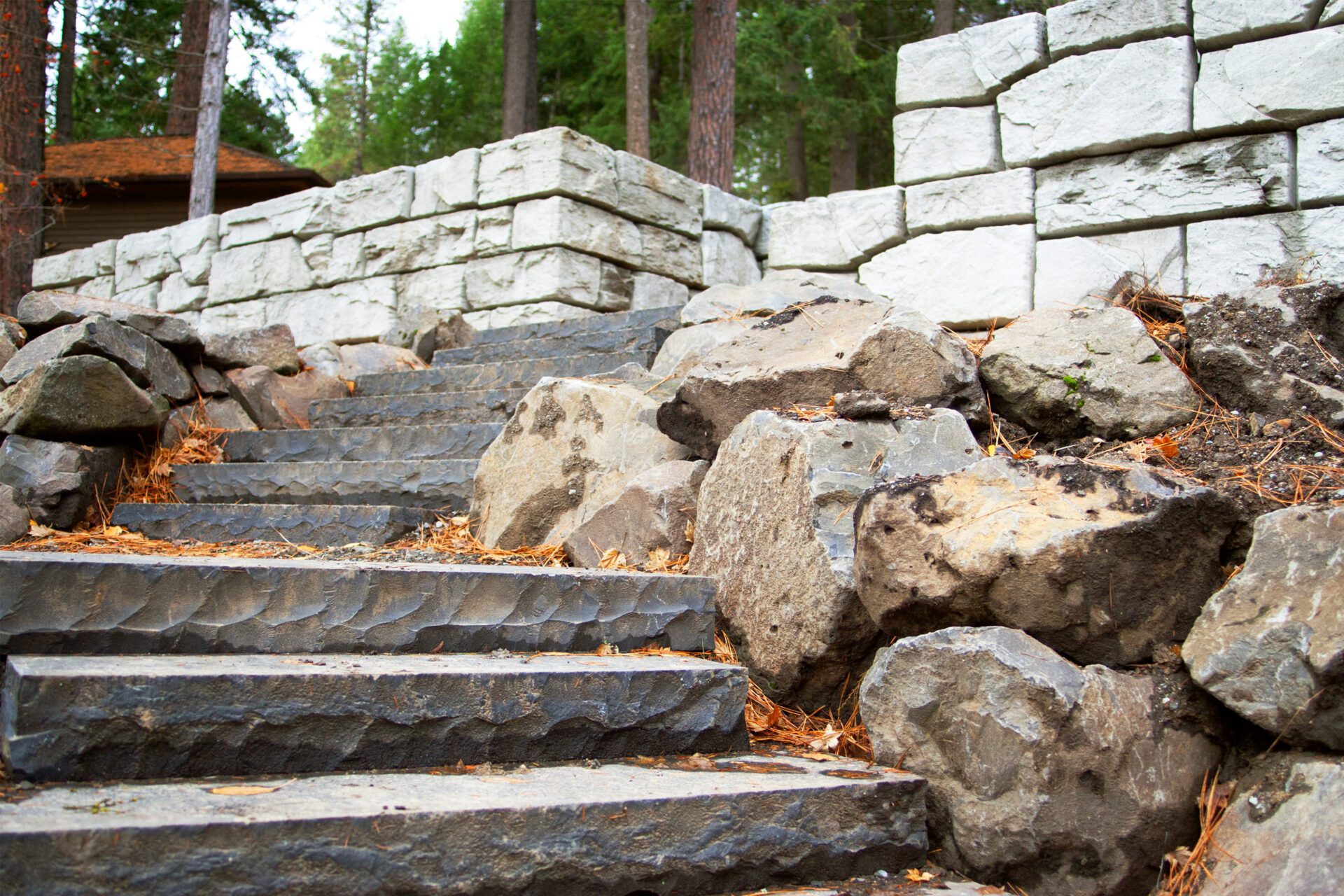 Custom hardscape stairs and block retaining wall project in Stanton by Blue Sky Decks.