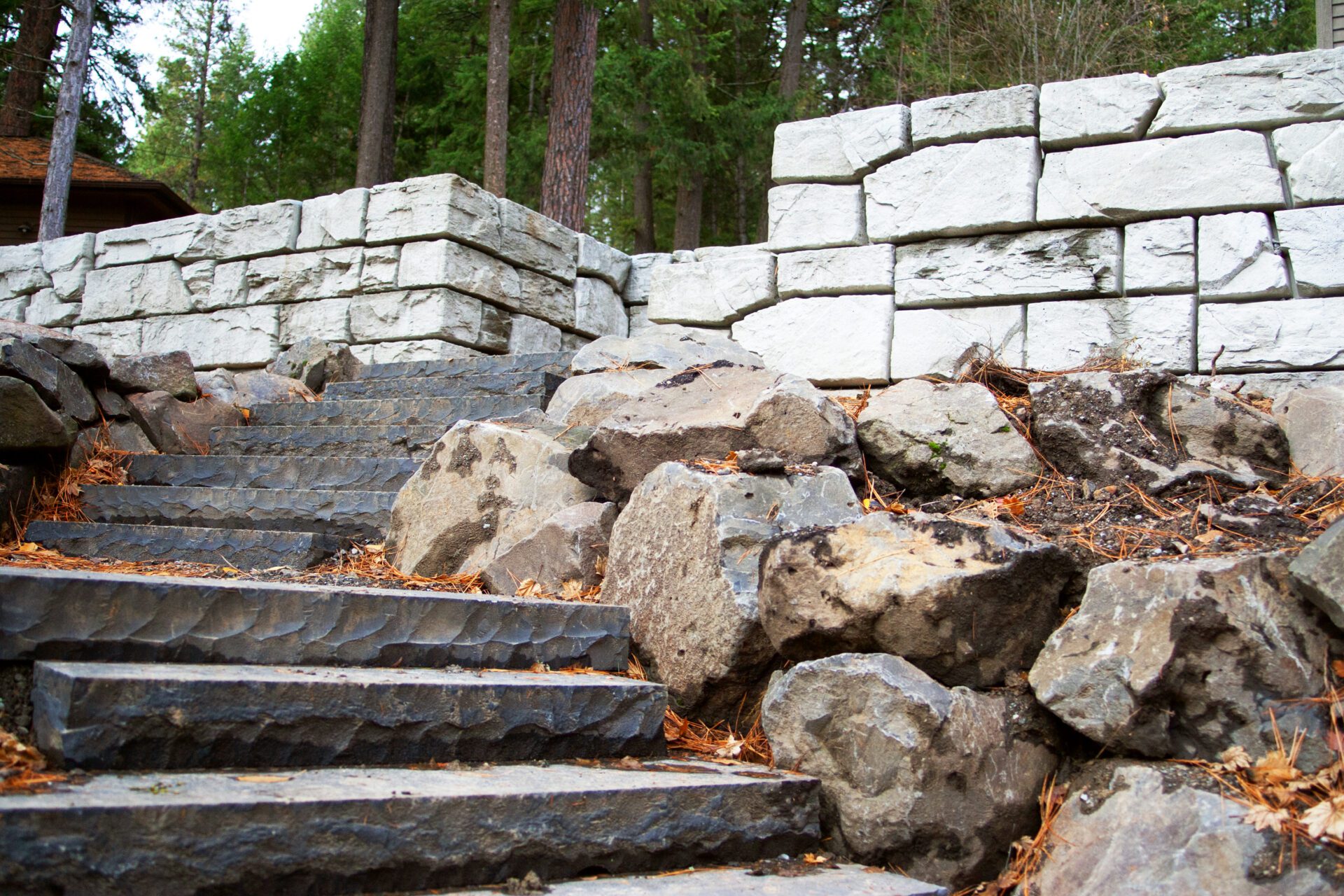 Custom hardscape stairs and block retaining wall project in Stanton by Blue Sky Decks.