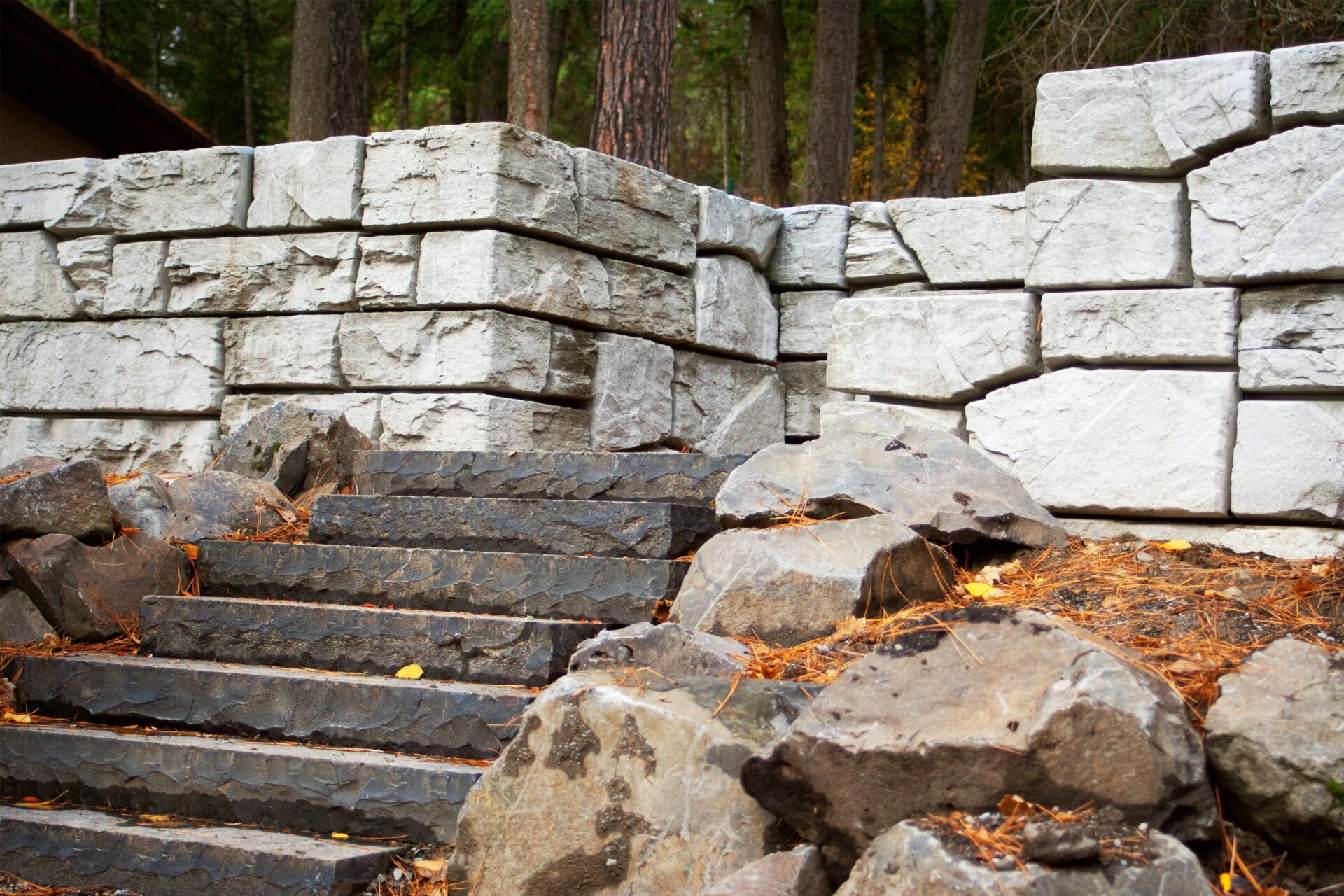 Custom hardscape stairs and block retaining wall project in Stanton by Blue Sky Decks.