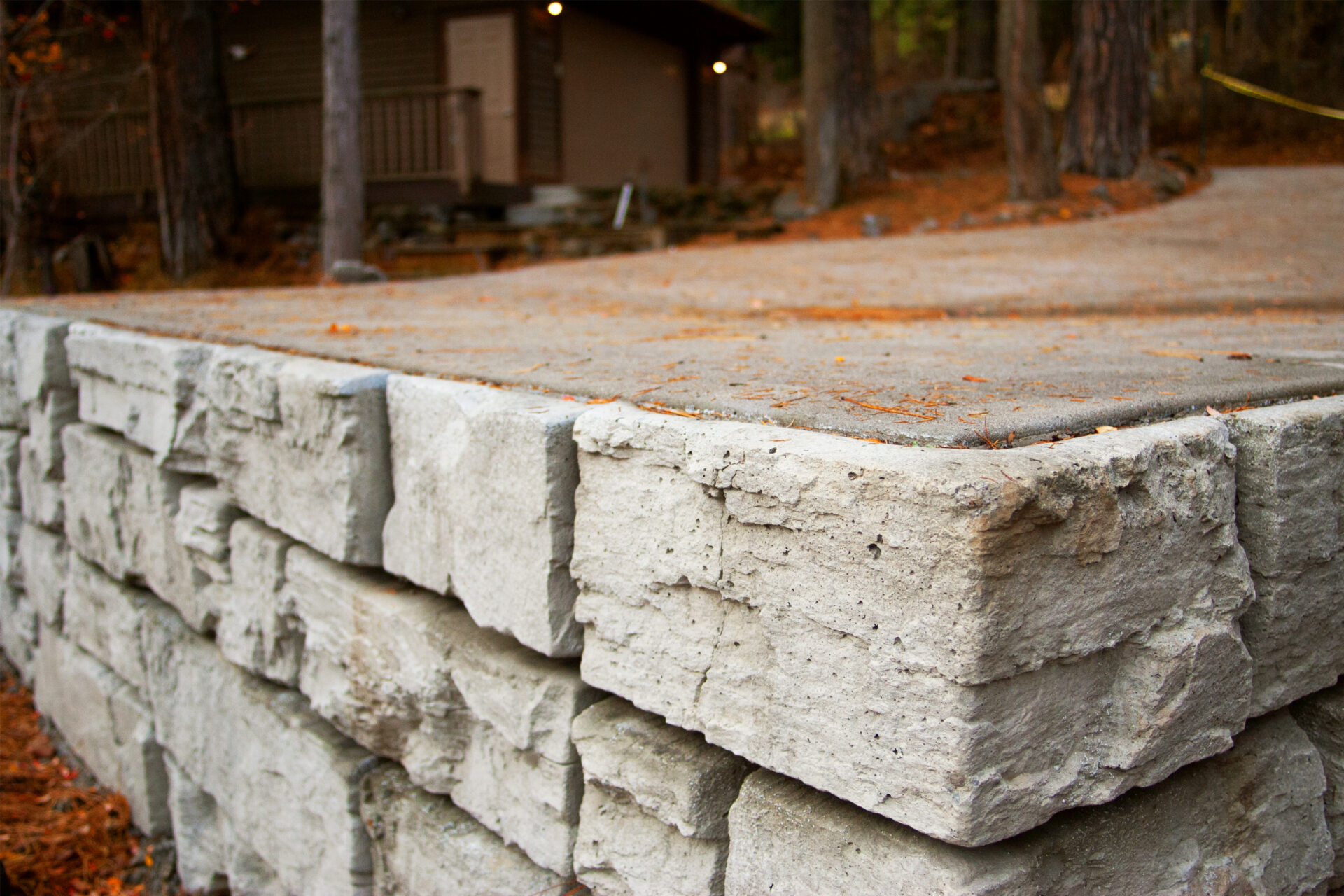 Stanton hardscape project featuring stone retaining wall and stair installation by Blue Sky Decks.